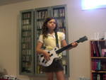 Holly on guitar